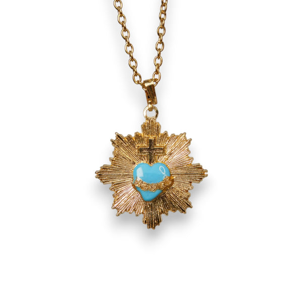Colgante corazón radiante azul y cruz