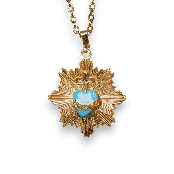 Colgante corazón radiante azul y cruz