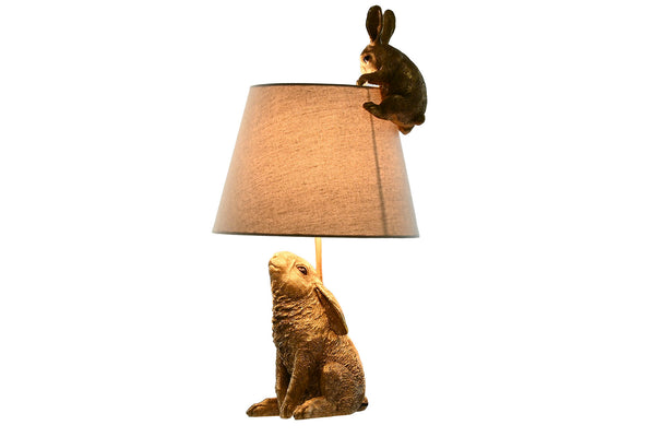 Lámpara de sobremesa conejos dorados