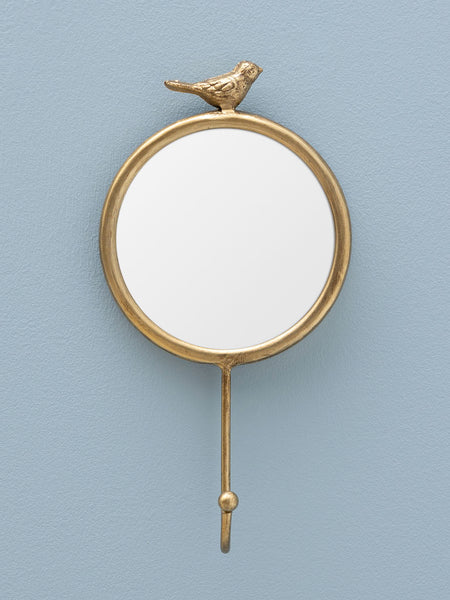 Percha de pared con pajarito y espejo en ambiente decorativo sobre fondo azul - Brocantia objetos decorativos originales en Oviedo