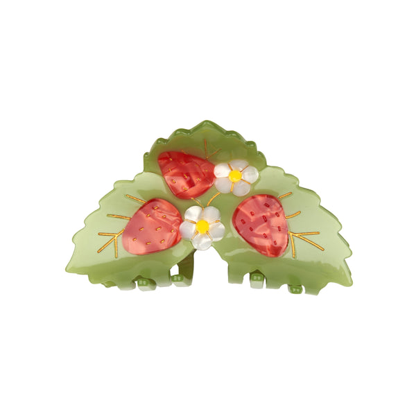 Pinza de pelo con fresas y hojas verdes Coucou Suzette vista frontal sobre fondo blanco