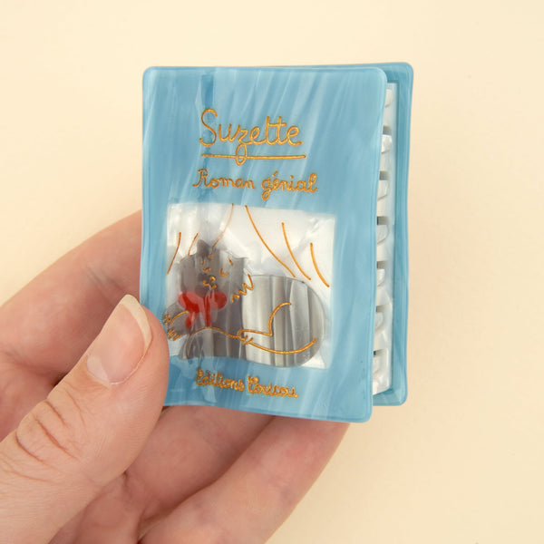 Pinza para el pelo libro