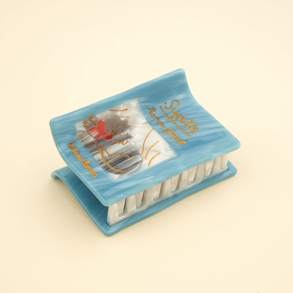 Pinza para el pelo libro