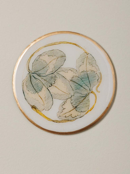 Posavasos de metal con ilustración de hojas verdes estilo vintage botánico con borde dorado