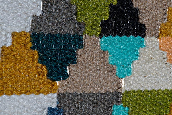 Detalle de tejido artesanal en tapiz de algodón y yute – Brocantia decoración singular