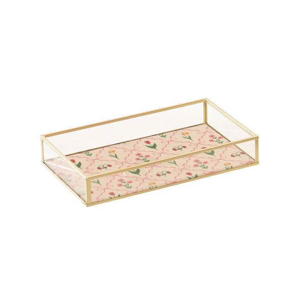 Bandeja decorativa de cristal y latón dorado con estampado floral rosa.