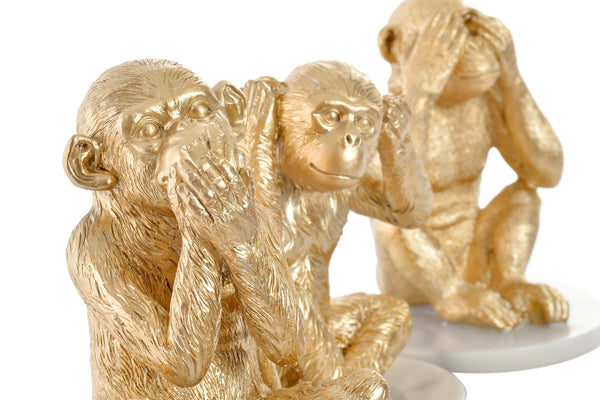 Detalle de las figuras de los tres monos sabios dorados