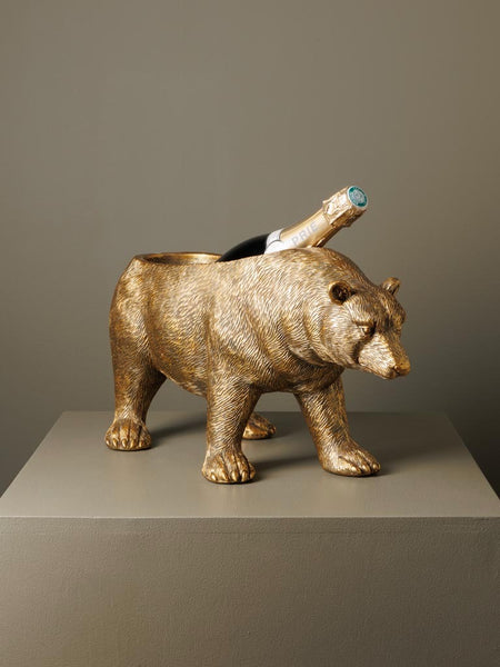 Figura de oso dorado con compartimento para botellas