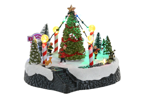 figura decorativa navideña con patinadores y luces de colores