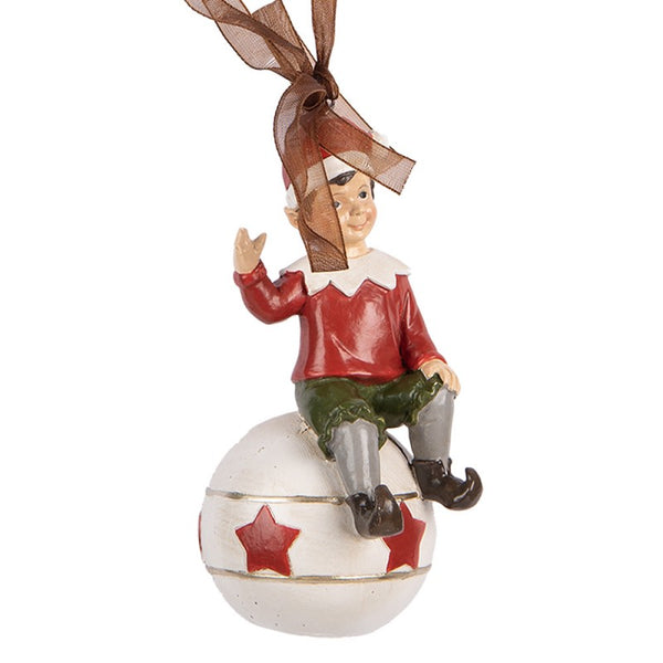 figura navideña elfo con gorro rojo sentado sobre bola