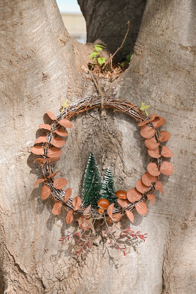 adorno navideño con luz LED y ramas trenzadas