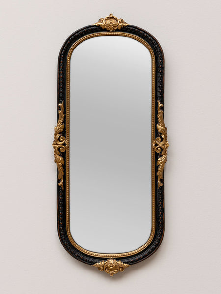 Espejo alargado negro con detalles dorados