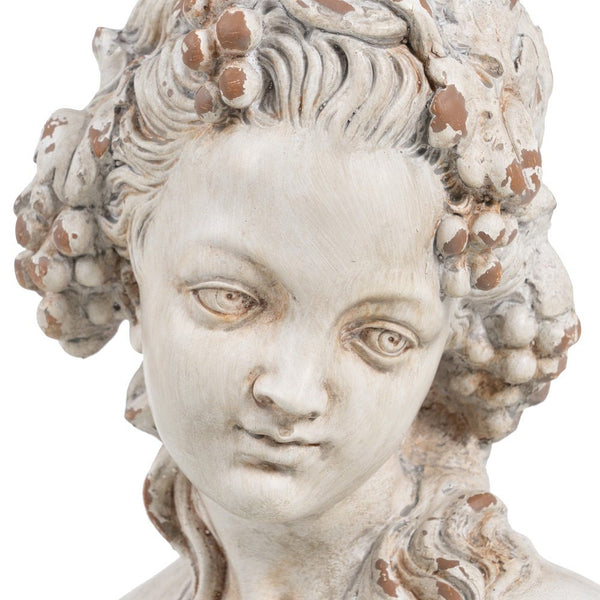 Primer plano del rostro en busto decorativo de mujer estilo griego.