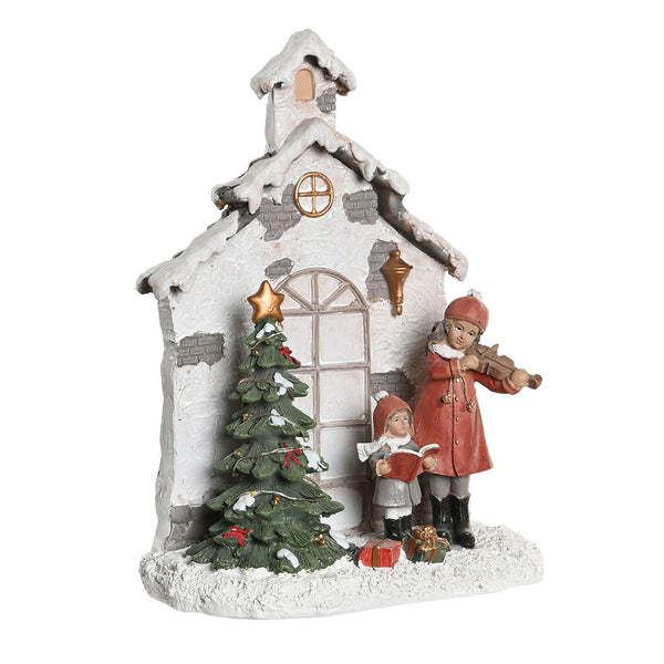 Escena navideña con niñas y árbol decorado