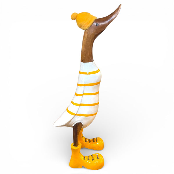Figura de pato con camiseta de rayas y botas amarillas