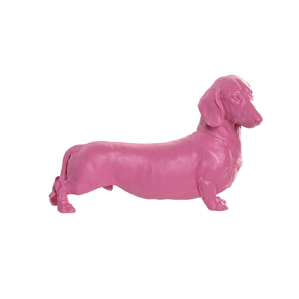 Figura decorativa perro salchicha rosa sobre fondo blanco