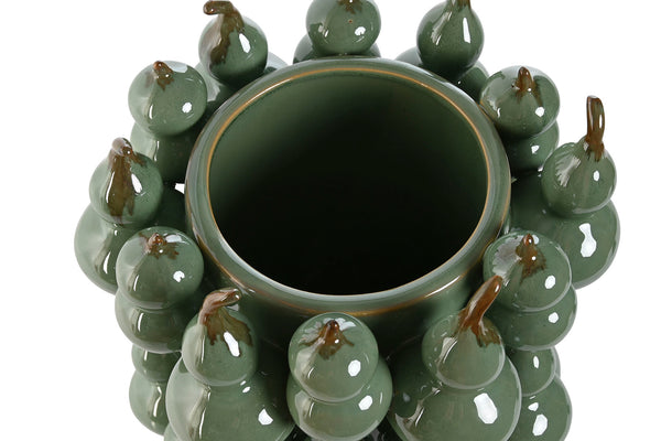vista superior de jarrón decorativo con calabazas cerámicas verdes