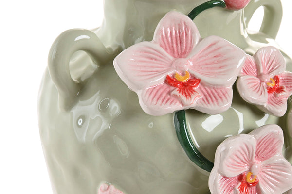 Detalle de orquídeas rosas en jarrón decorativo