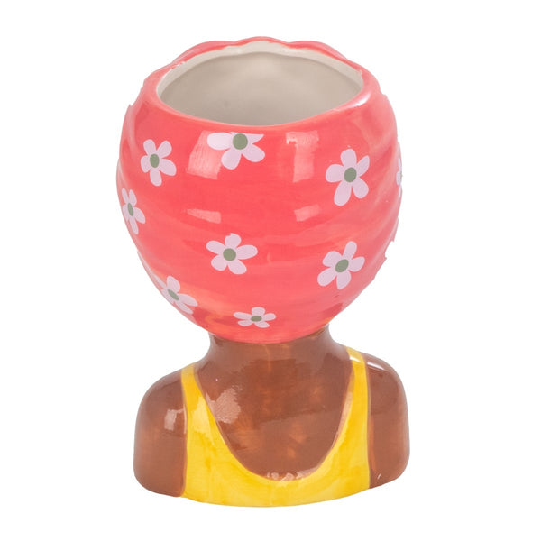 vista trasera jarrón busto mujer con pañuelo flores blancas sobre rosa Brocantia