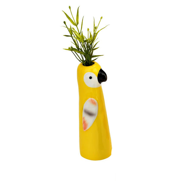 Jarrón de porcelana con diseño de loro amarillo con flor decorativa.