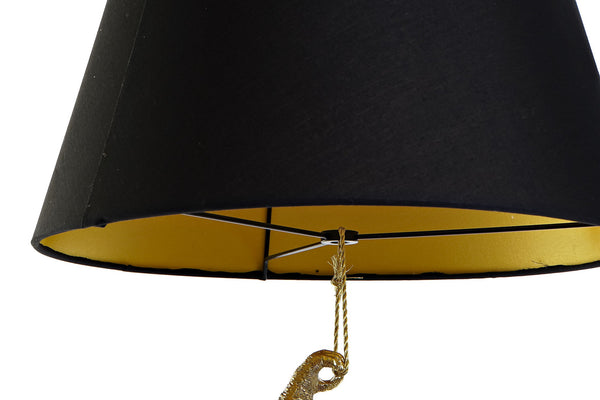 Detalle pantalla lámpara negra con interior dorado