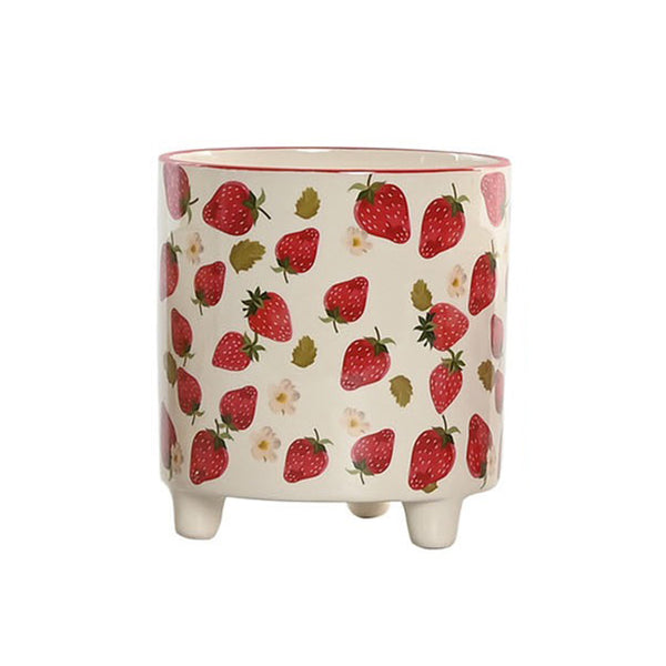 Maceta de cerámica con estampado de fresas sobre fondo blanco, vista frontal