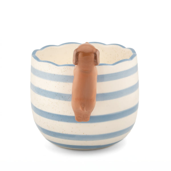 Vista trasera del macetero de porcelana con figura de perro salchicha.