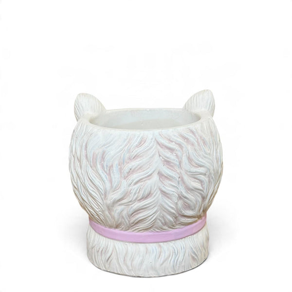 Vista trasera del mini macetero gato de cerámica mate con textura de pelo y collar rosa.