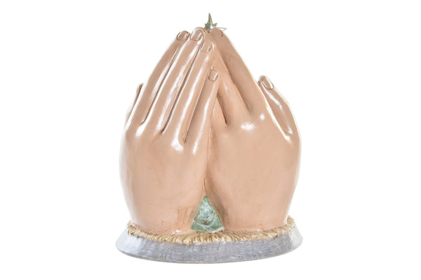 decoración de Navidad con nacimiento dentro de manos orantes