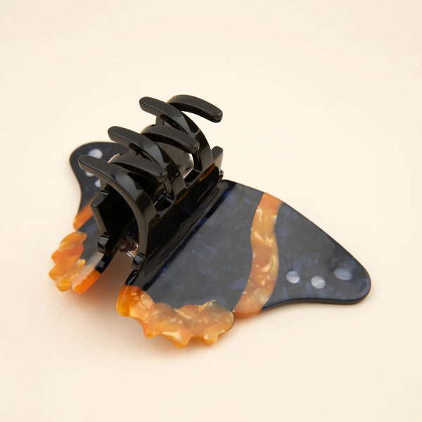 Accesorio pelo mariposa colores negro y naranja