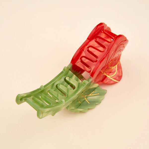 Pinza de pelo con forma de rosa roja y tallo verde