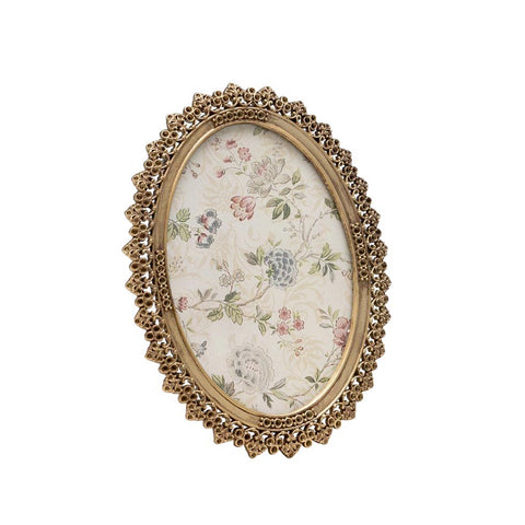Portafotos ovalado con florecitas doradas estilo vintage sobre fondo blanco – Brocantia tienda de decoración en Oviedo.