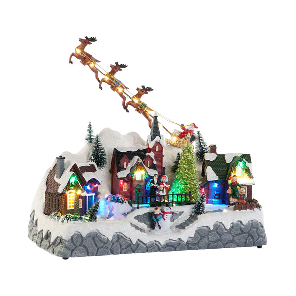 pueblo navideño iluminado con trineo de Papá Noel y luces LED